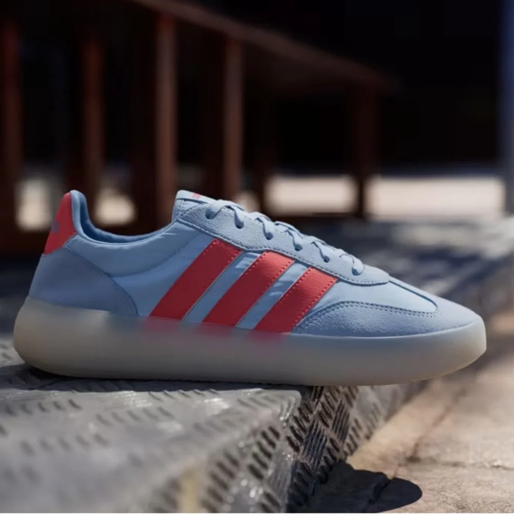 adidas Men’s Light Blue Sneakers with Orange Stripes